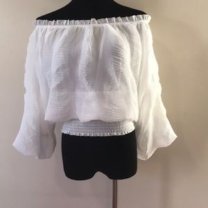 Cropped crinkled polyester crop top bell sleeves.